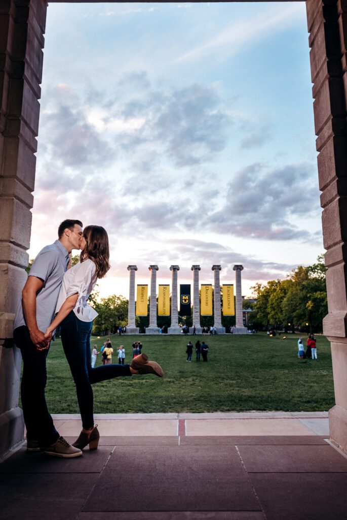 couple kissing in near Mizzou Columns