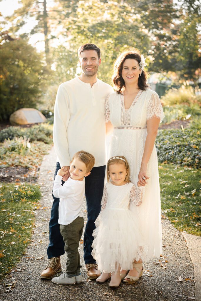 family wearing white smiling Shelter Gardens, Columbia, MO