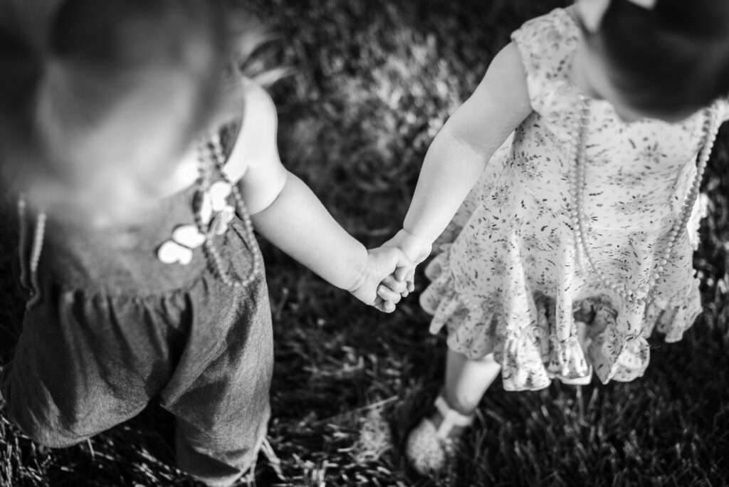 Friends holding hands and walking