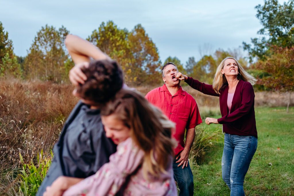 family having a fake fight during family shoot