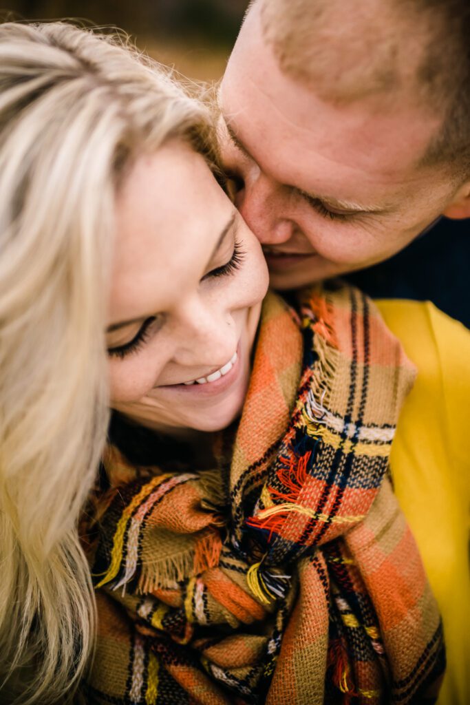 guy kissing girlfriend's cheek