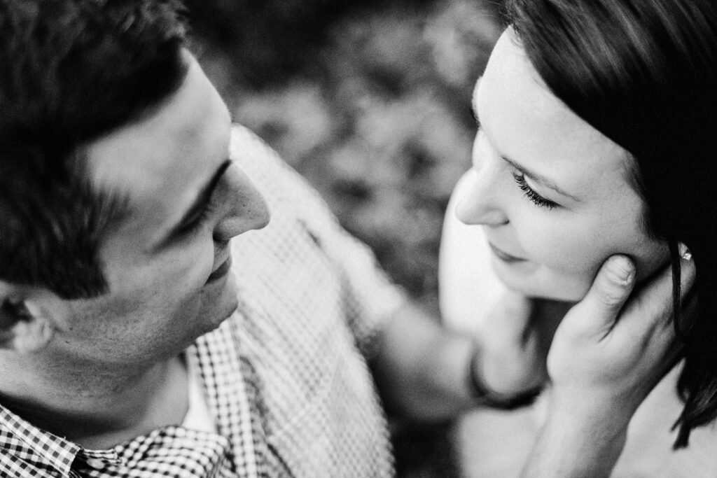 fiance holding girl's face in hands lovingly