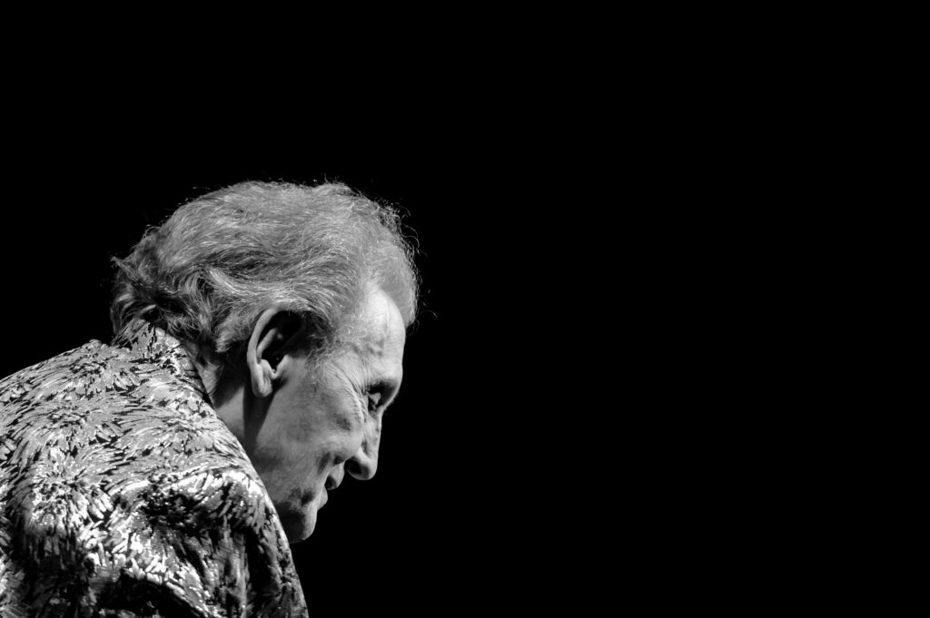 Jerry Lee Lewis smiling and looking down