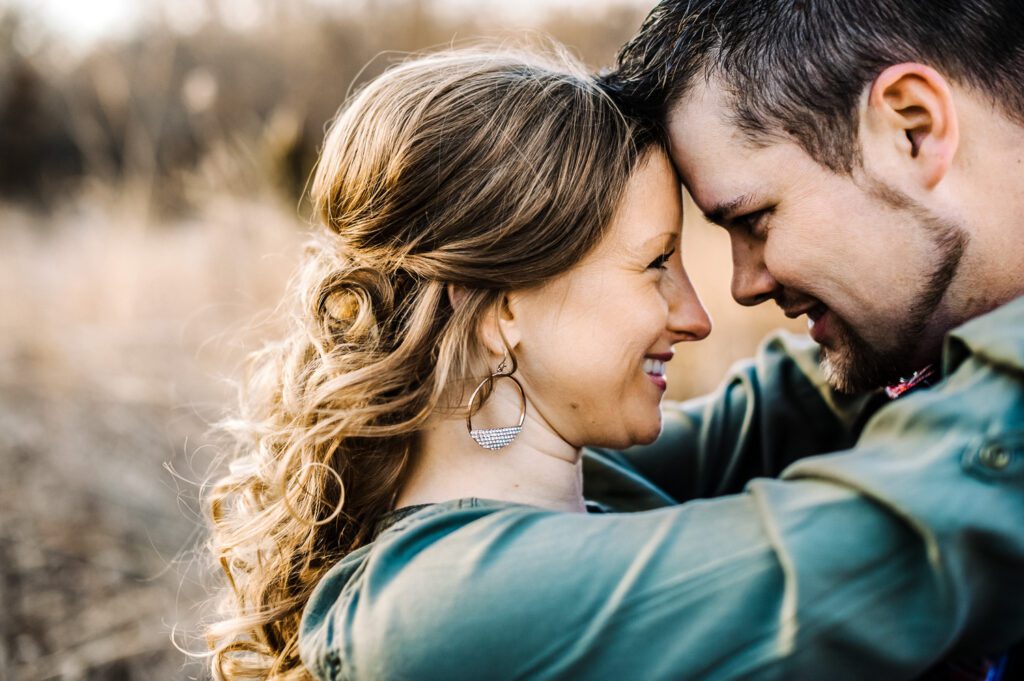 couple smiling and touching foreheads