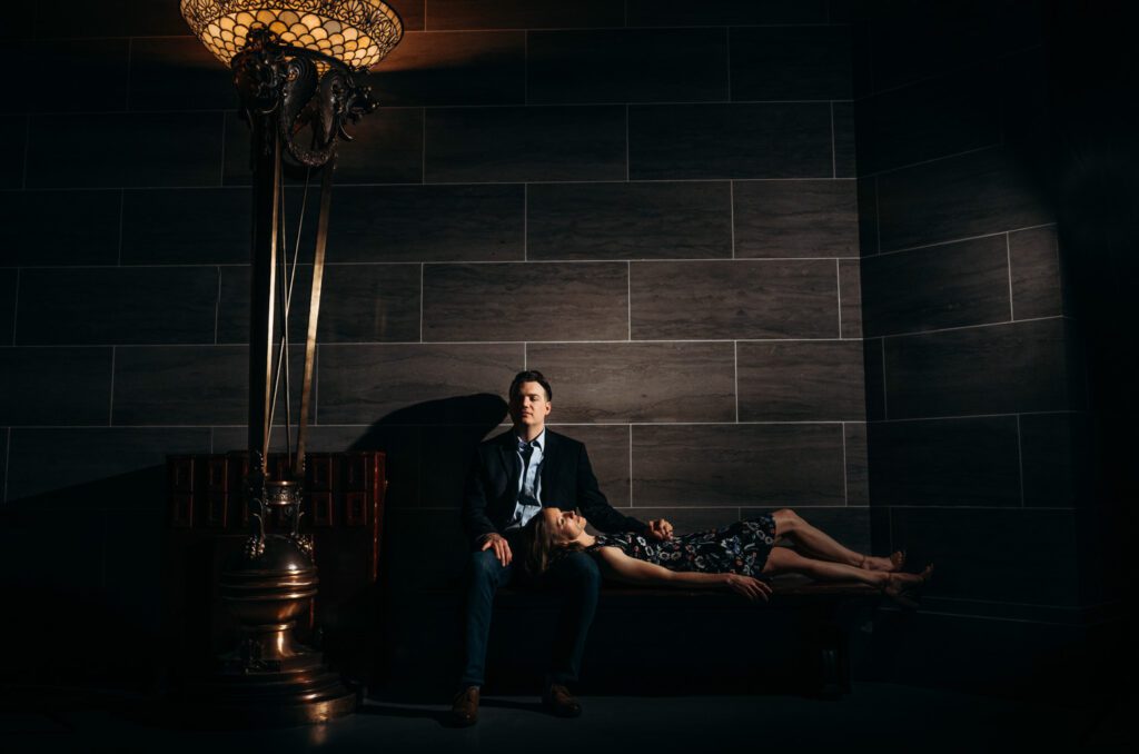 couple laying on bench in Missouri State Capitol Jefferson City