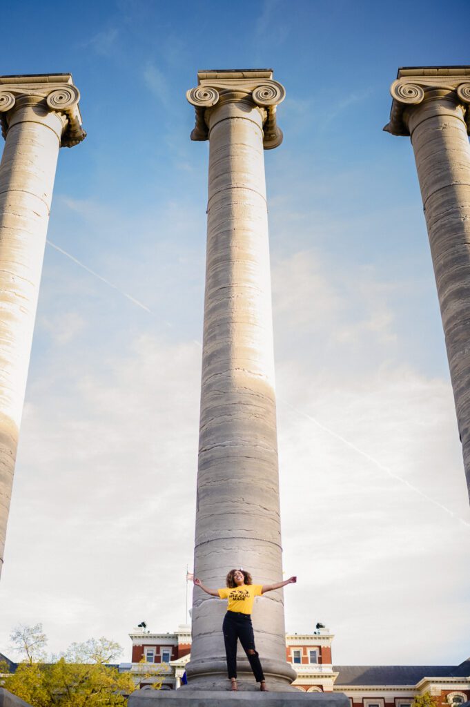 mizzou senior girl standing on column