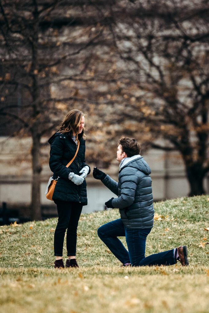 down on one knee proposing cold weather