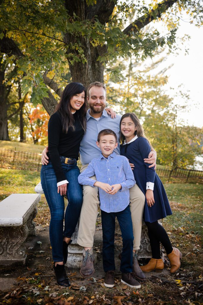 mother and father with family in backyard on table