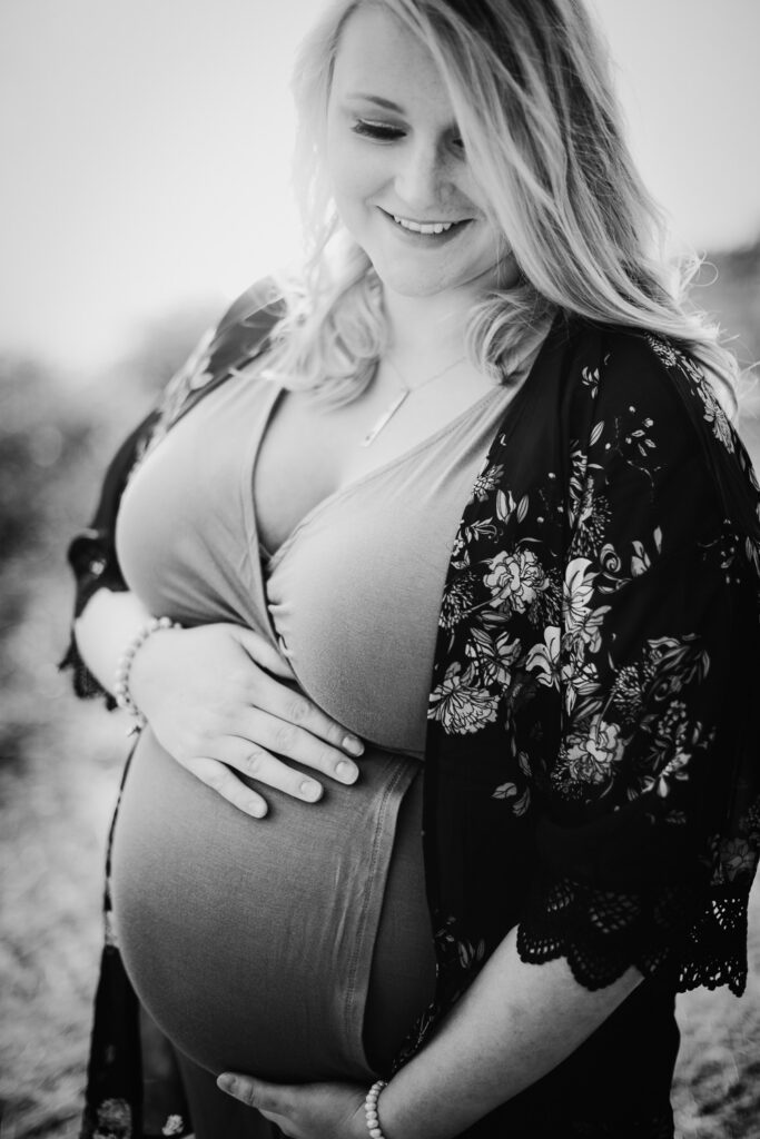 new mom holding baby bump