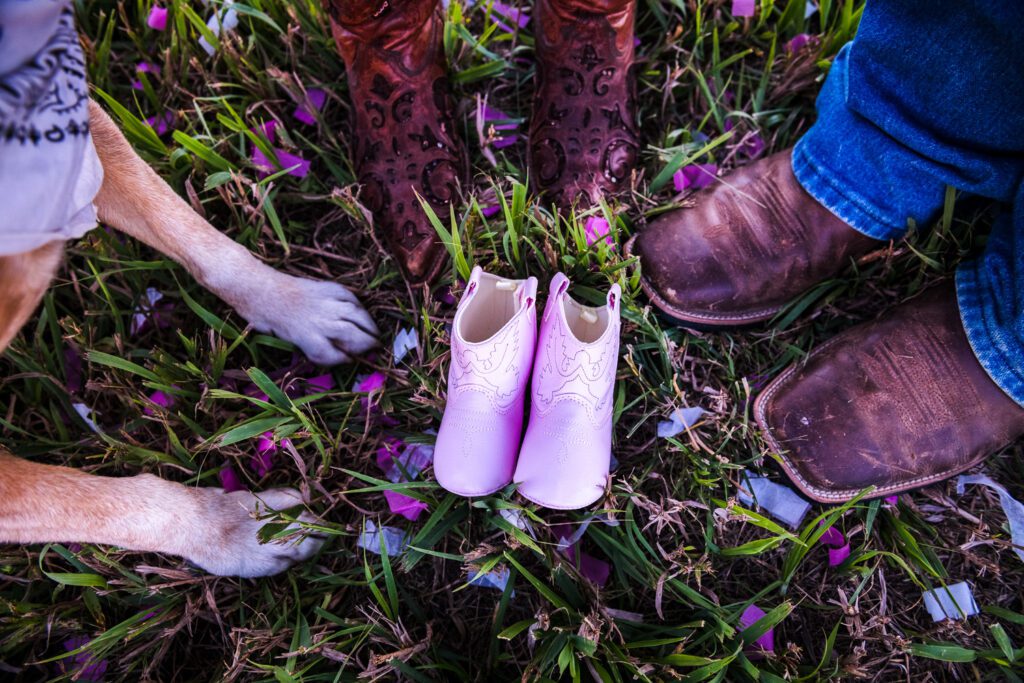 dog paws and cowboy boots with pink baby boots