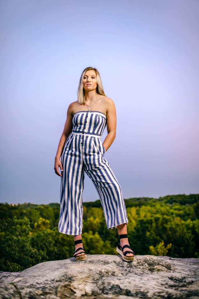 Senior Girl Standing On Rock