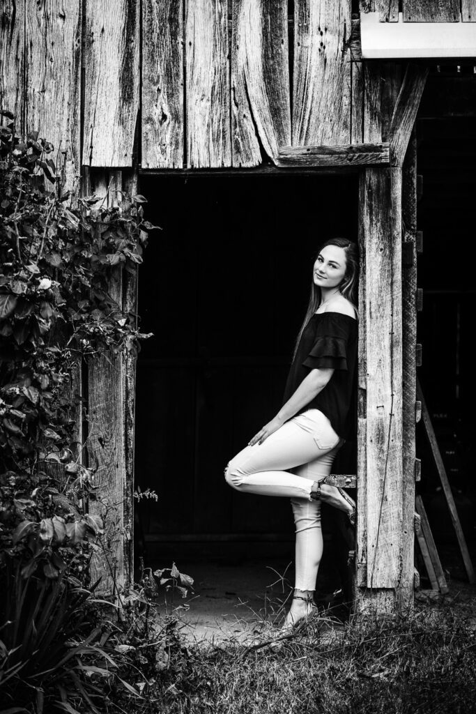senior girl leaning in doorway