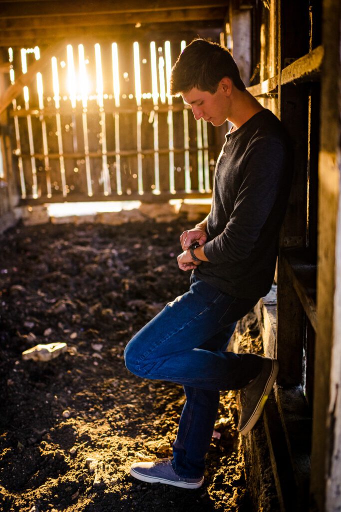 senior guy inside barn