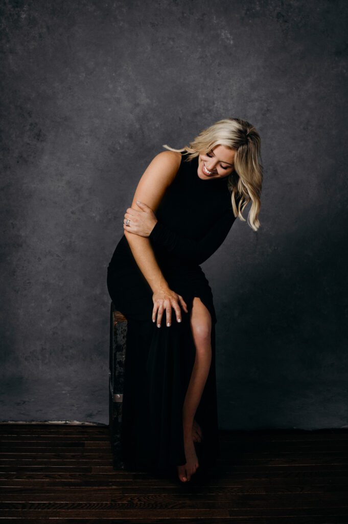 girl holding arm with engagement ring Oliphant backdrop