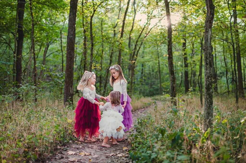 three girls dancing fluffy dresses rock bridge state park