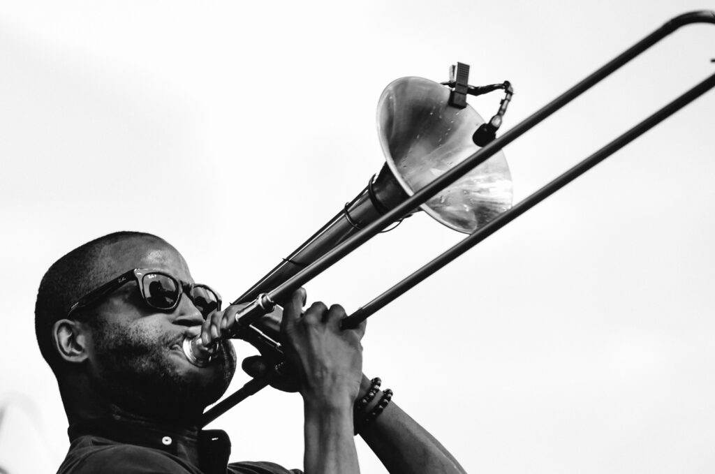 Trombone Shorty playing trombone up close