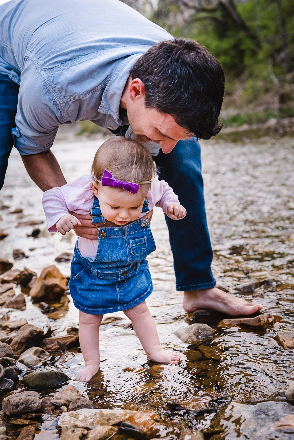 Family photograph of dad and daughter by creek - Kasmann Family Photos by Schaefer Photography in Capen Park, Columbia, Missouri.