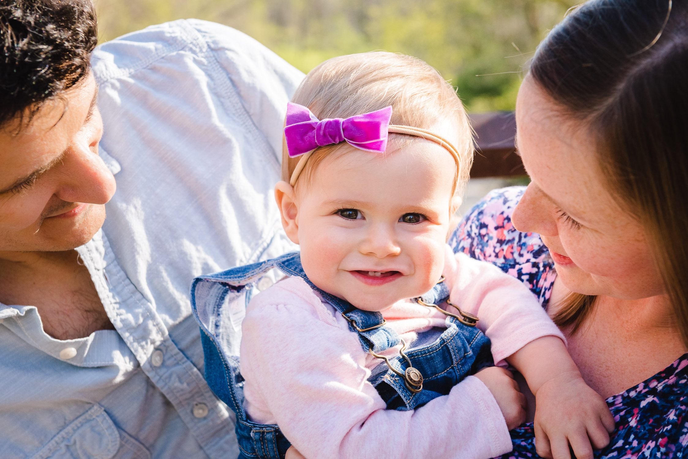 Cute smile from daughter during family photographs for Kasmann Family Photos by Schaefer Photography in Capen Park, Columbia, Missouri.