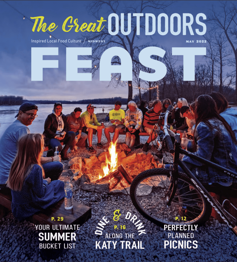 Feast Magazine Cover group of people sitting by fire at Cooper's Landing