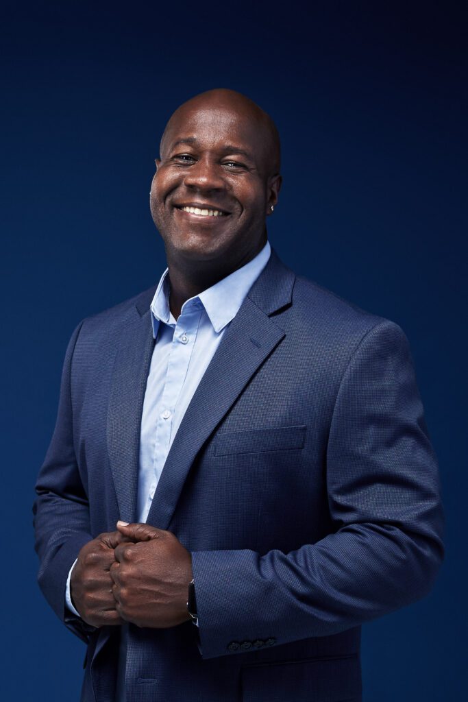 Man wearing blue suit on blue background