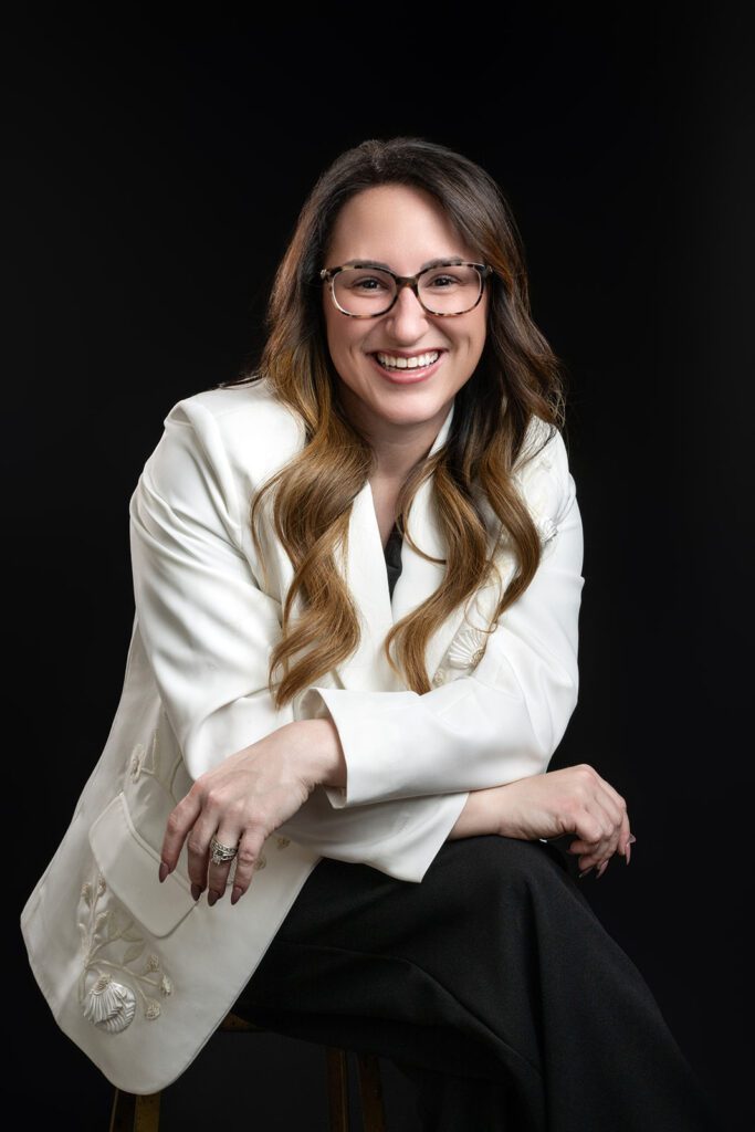 professional headshot female long hair white blazer