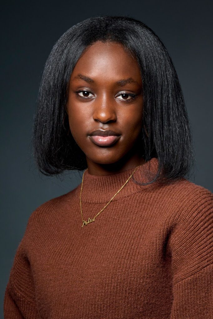 Thehillah Irisa wearing brown sweater