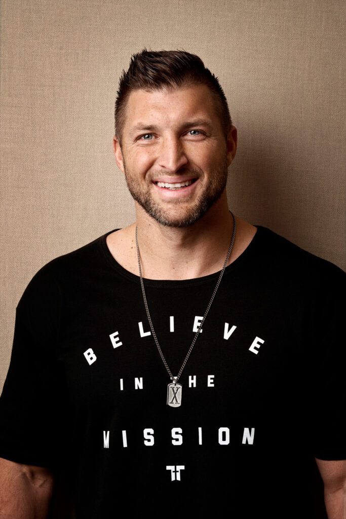Tim Tebow smiles for a portrait