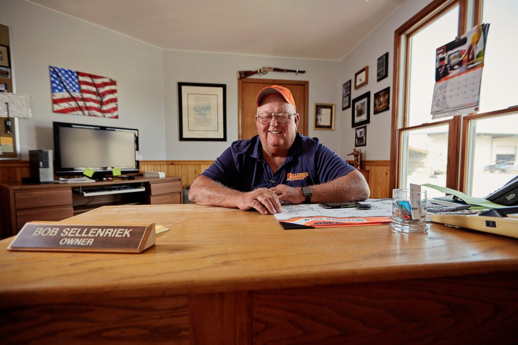 Construction worker sitting at office desk