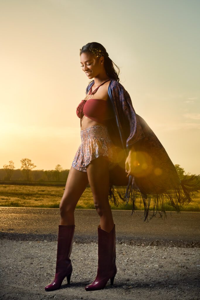 Model wearing flowing cape for a coachella look