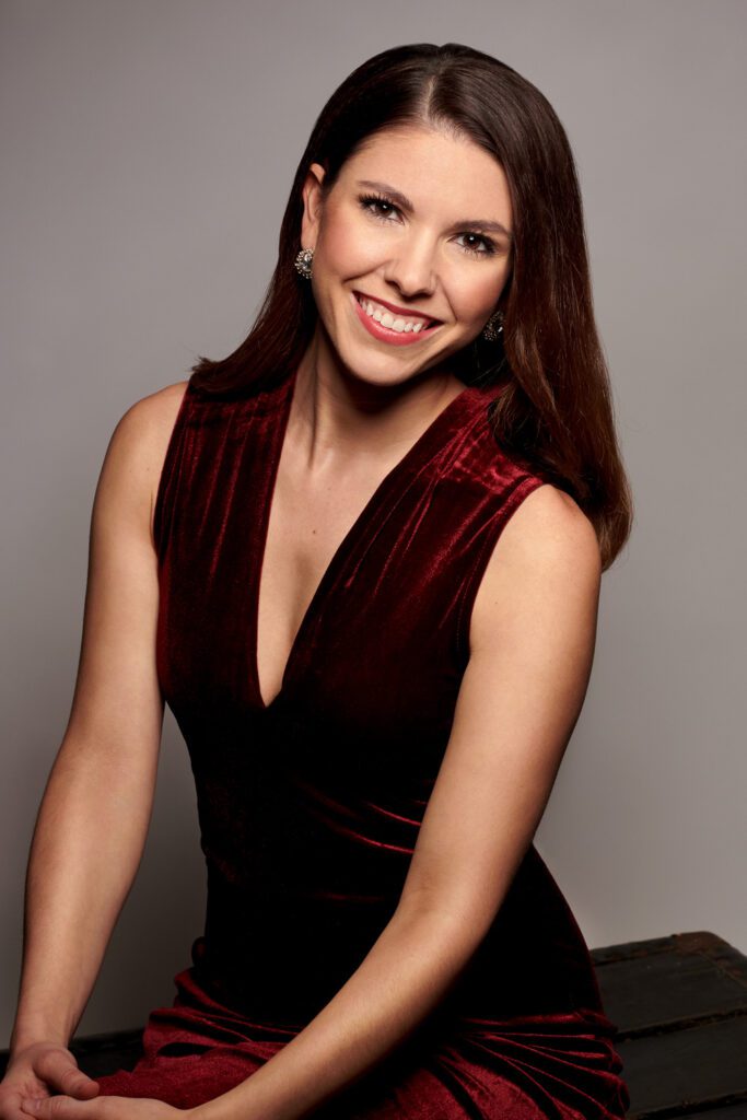 news anchor smiles in velvet jumpsuit Emmy winning