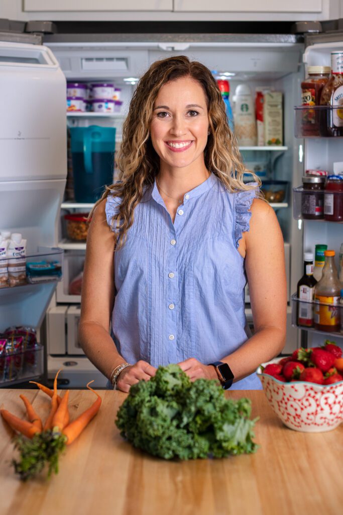 dietician with food in kitchen promoting business