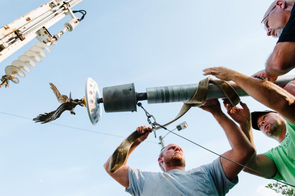 Jake Tamm raises flag pole