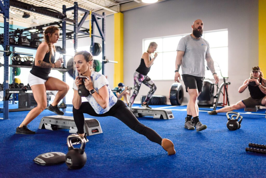 Athletes work out as instructor coaches