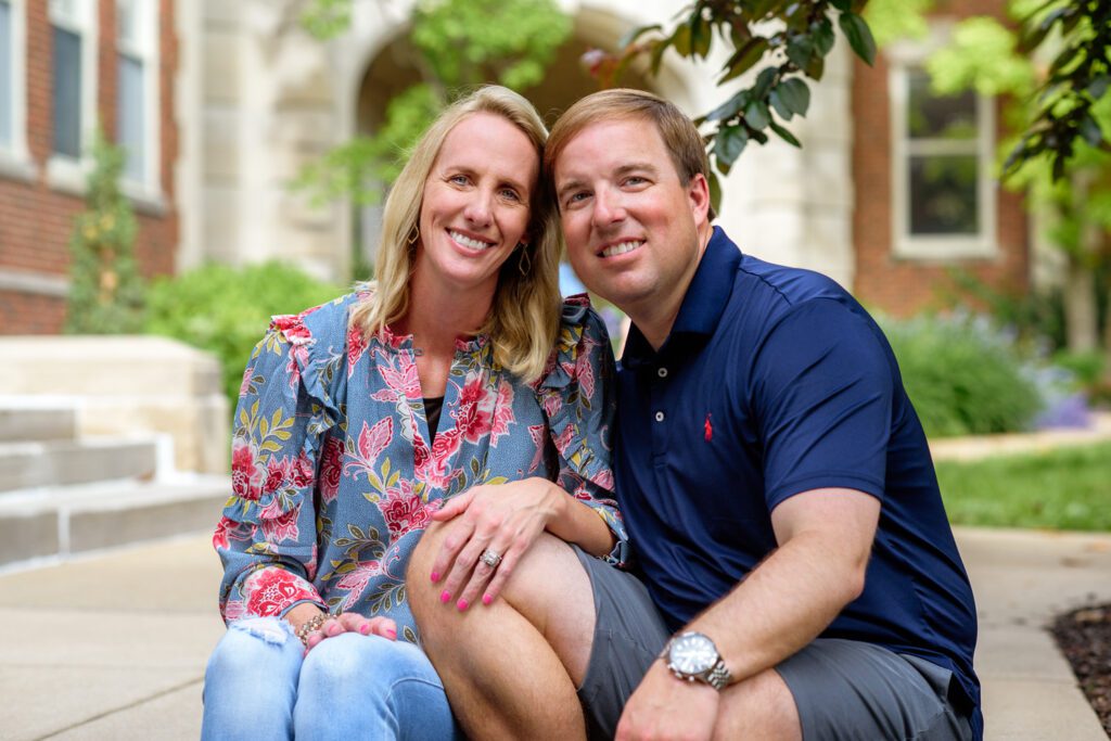 Eli and Lindsey Drinkwitz sit together on the University of Missouri Columbia Campus.