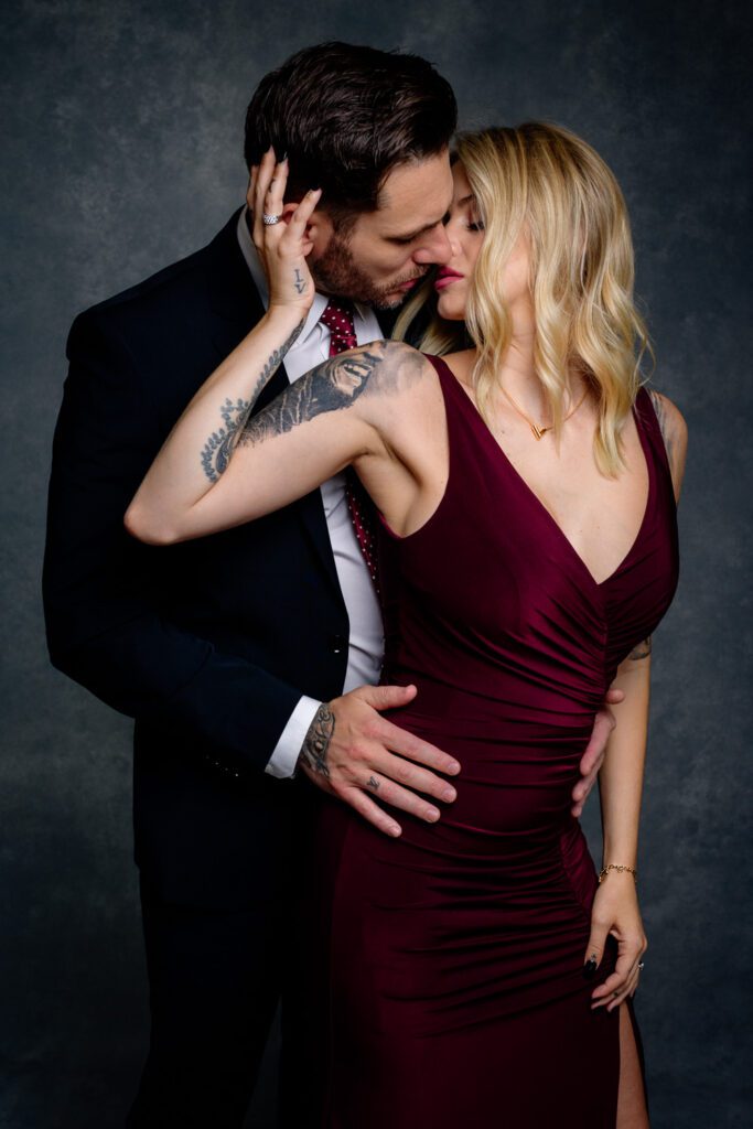 romantic couple just about to kiss wearing a red tie and dress