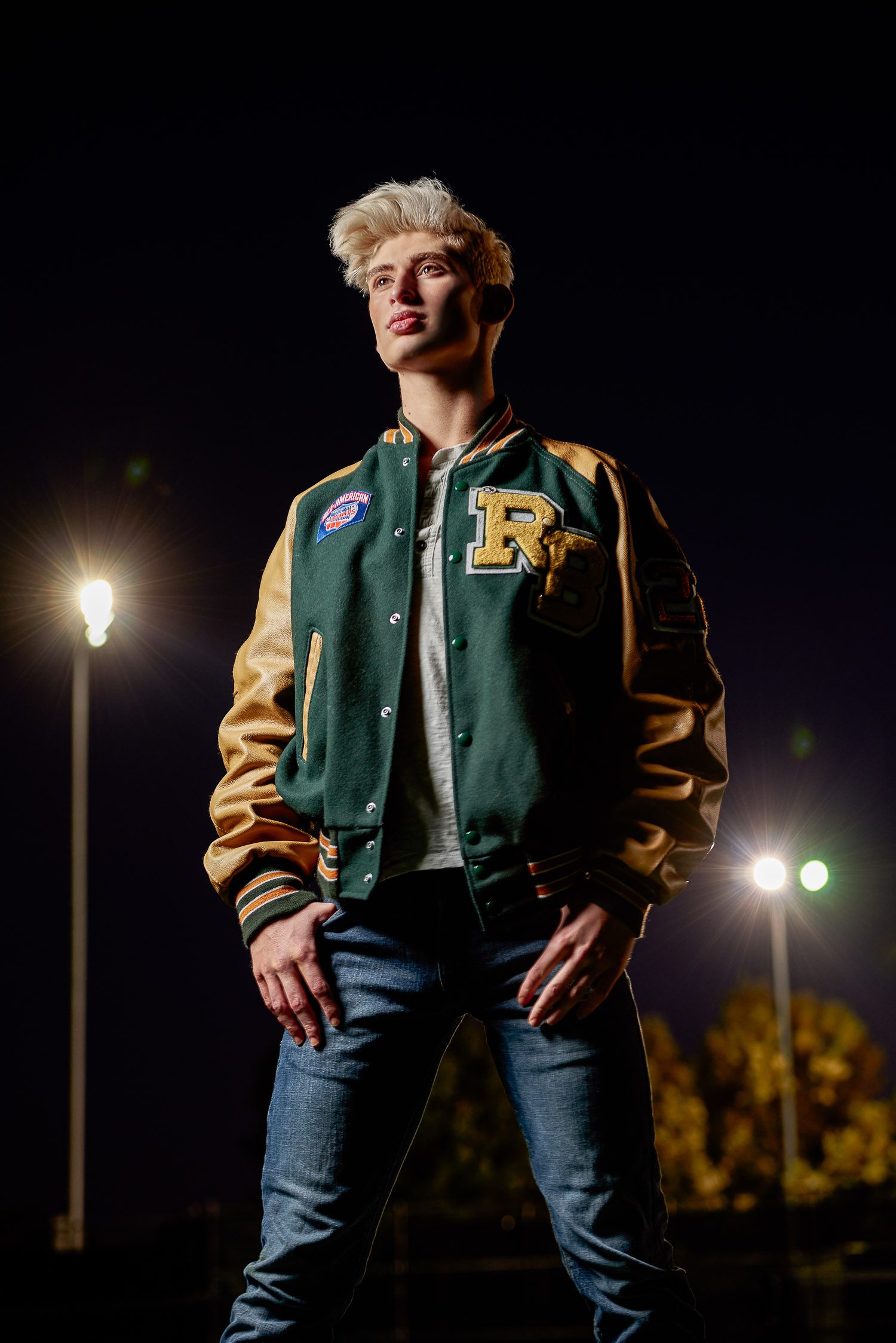 Rock Bridge Senior with lights in background