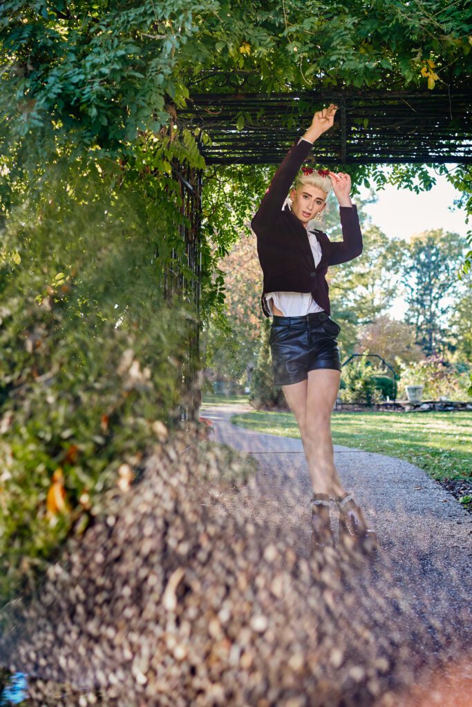 Senior Zachary Willmore holds onto arbor at Shelter Gardens in Columbia, Missouri.