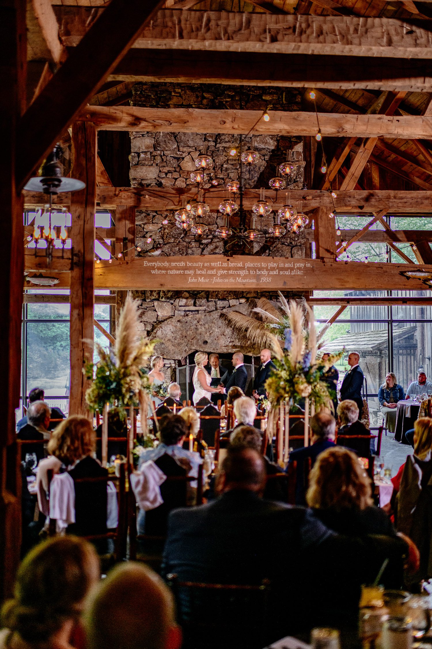 Wedding ceremony inside Dogwood Canyon Lodge and Mill Schaefer Photography