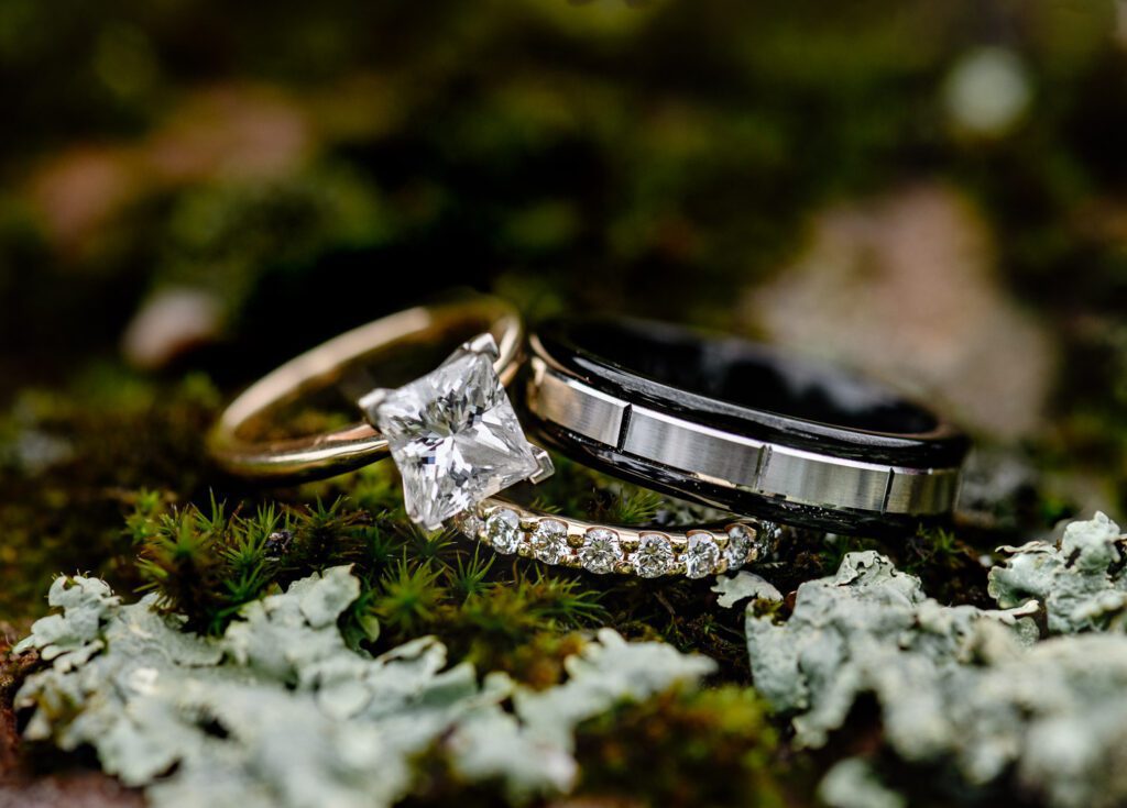 Diamond Ring and other wedding rings on moss