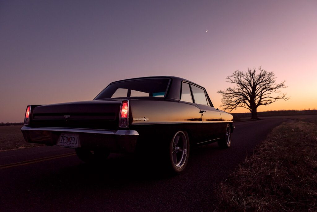 1967 Black Chevy II with Big Tree at Sunset near Columbia, Missouri.