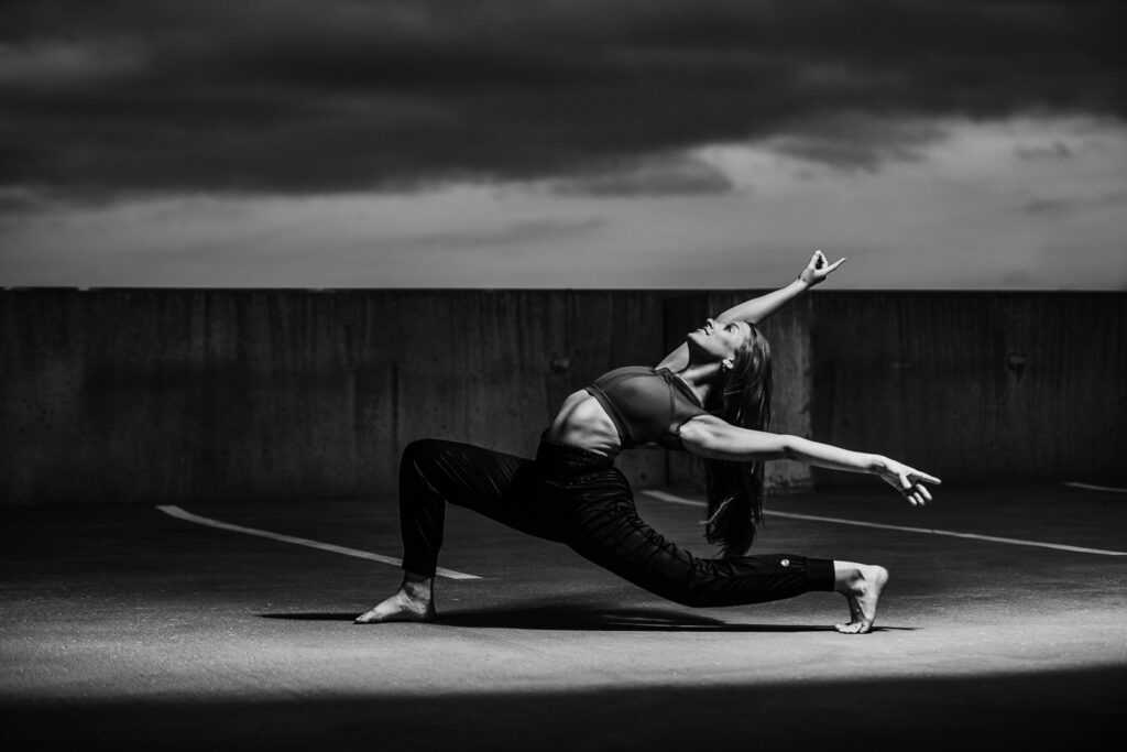 Female dancer strikes a pose on top of a parking garage in Columbia, Mo.