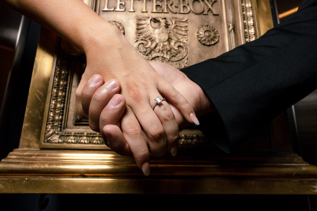 Wedding ring and vintage gold mail letterbox with eagle