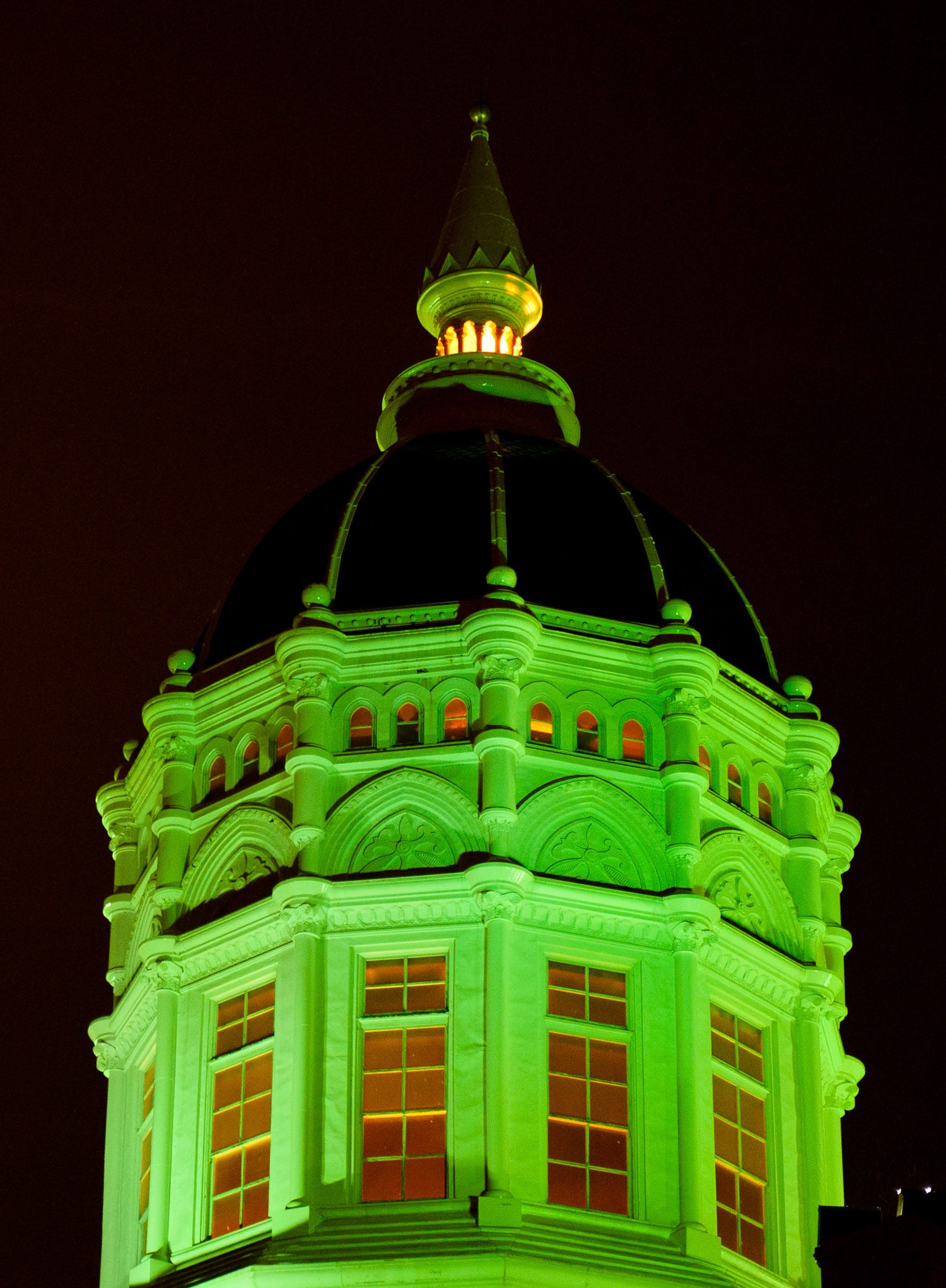 Green Lights light up the dome of Jesse Hall.