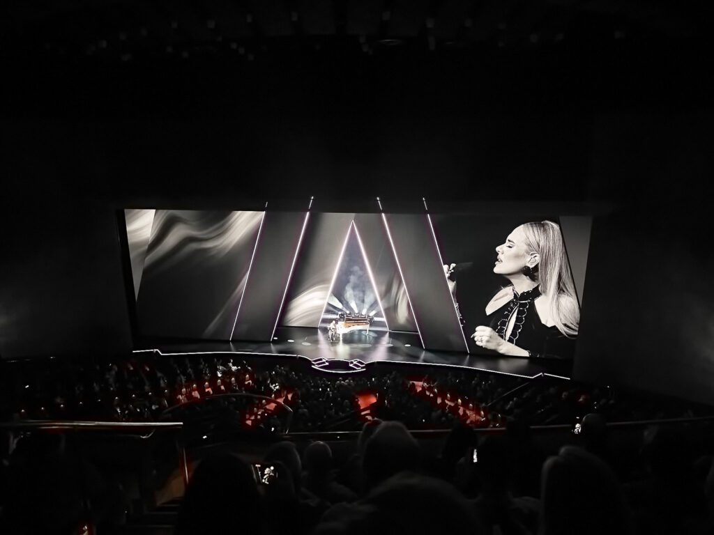 Black and white image on stage during Adele's performance at Colosseum at Caesars Palace in Las Vegas by Schaefer Photography.