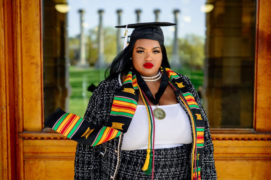 Senior girl poses on the University of Missouri Campus.