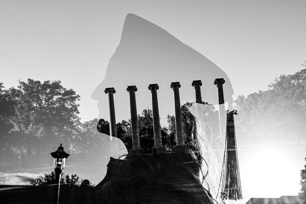 A double exposure of a senior girl and the mizzou columns in Columbia, Missouri.