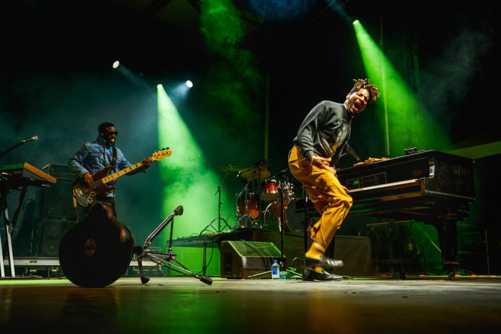 Jon Batiste shows emotion after kicking piano stool on stage at the 2022 Roots and Blues Festival in Columbia Missouri.