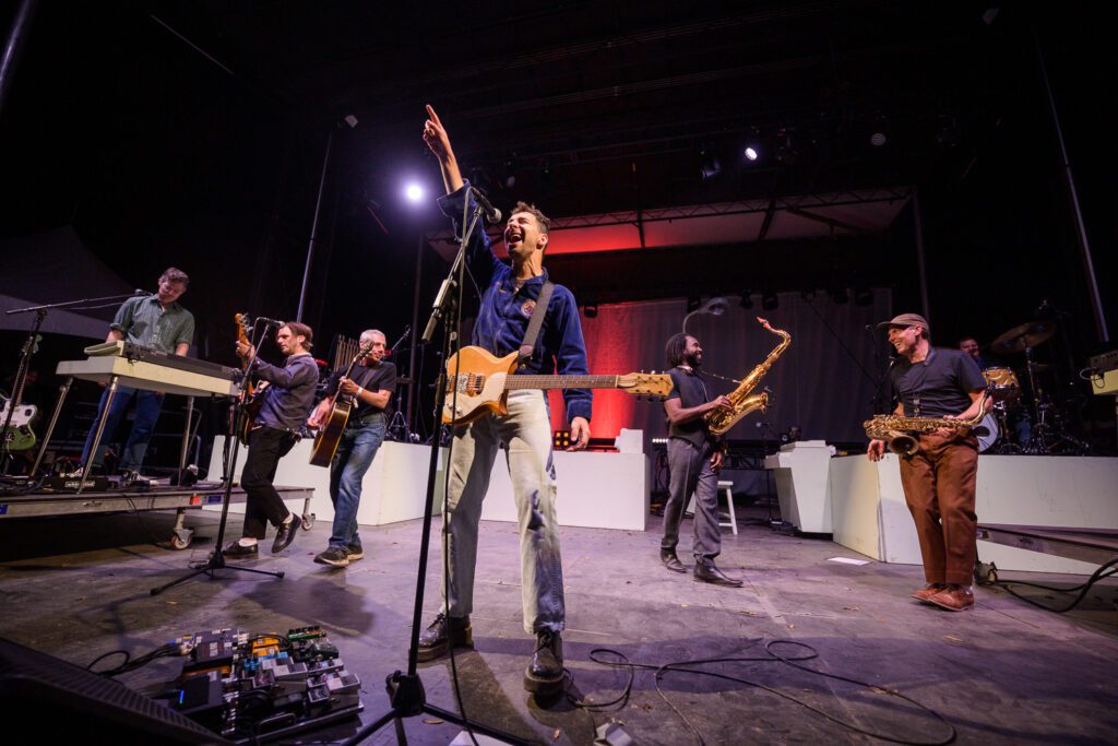 Jack Antonoff points up while performing at the 2022 Roots and Blues Festival in Columbia, Missouri.