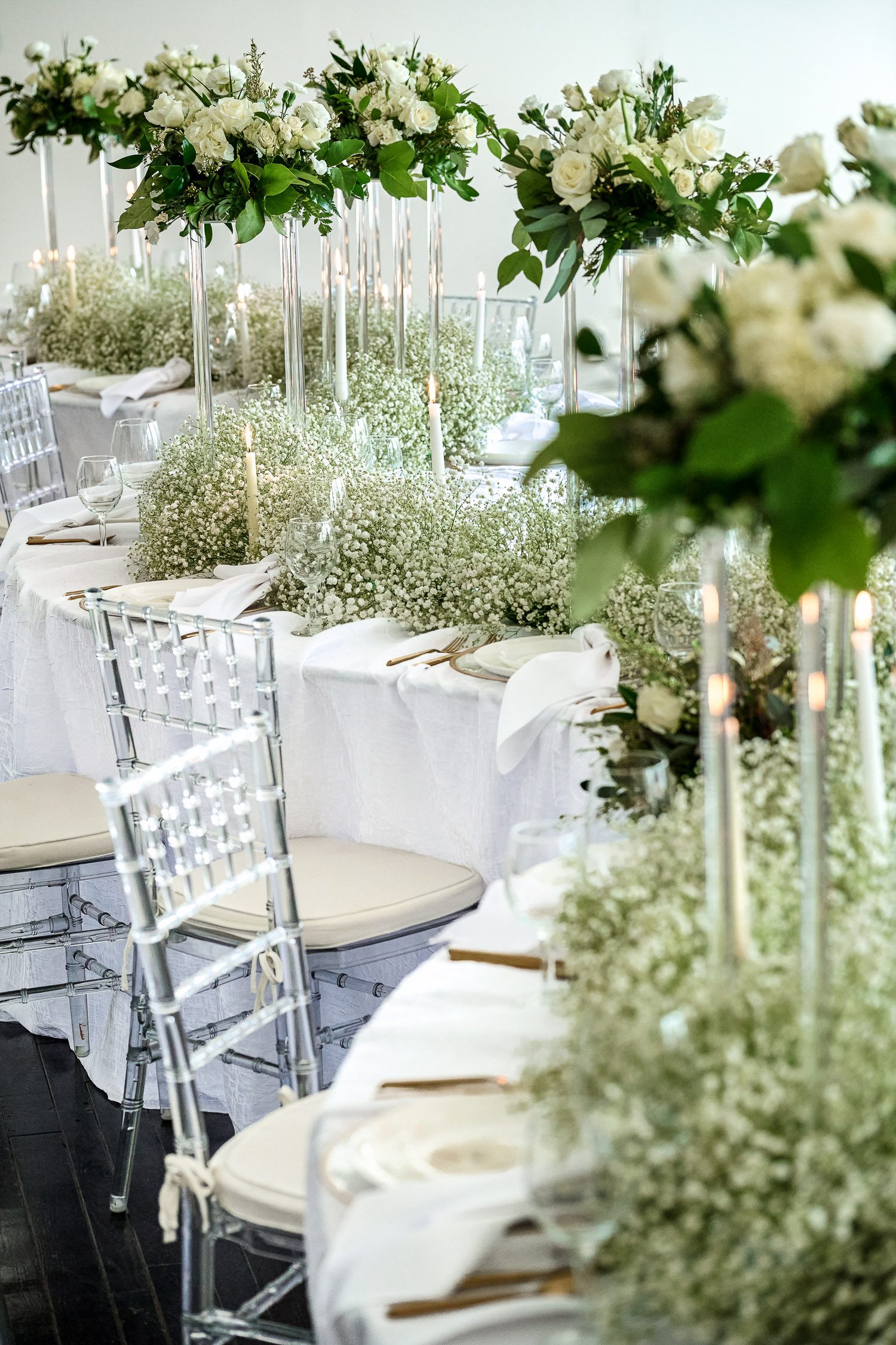 Baby Breath S Curve table with acrylic chairs set for wedding.