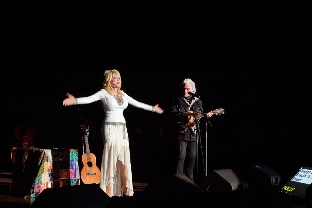 Dolly parton acknowledges the crowd after taking the stage at the Congress of Country Music.